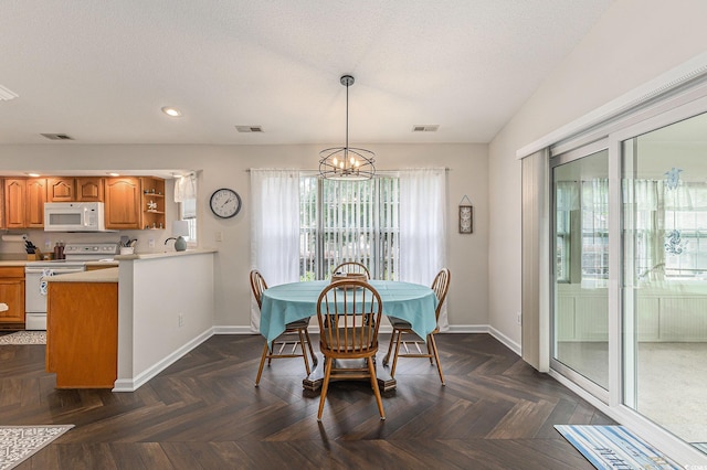 2479 Glen Dr, Little River, SC 29566 - dining space with a chandelier, baseboards, recessed lighting, and a textured ceiling
