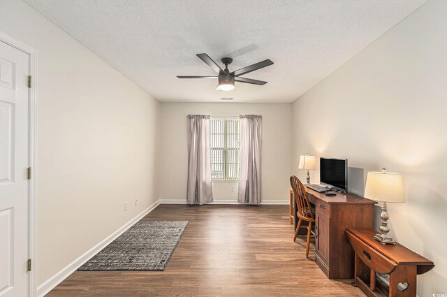 2479 Glen Dr, Little River, SC 29566 - home office featuring wood finished floors, ceiling fan, baseboards, and a textured ceiling