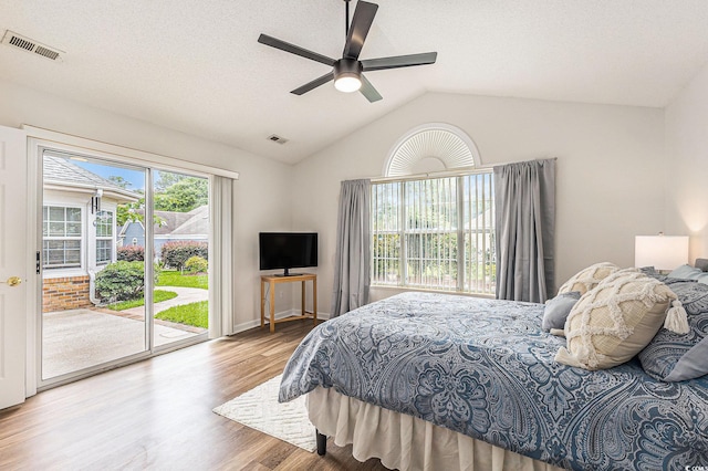 2479 Glen Dr, Little River, SC 29566 - bedroom with access to exterior, wood finished floors, vaulted ceiling, and ceiling fan