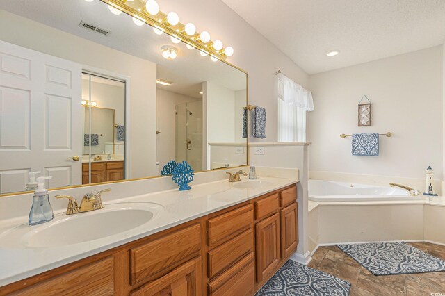 2479 Glen Dr, Little River, SC 29566 - bathroom featuring a garden tub, double vanity, a shower stall, and baseboards