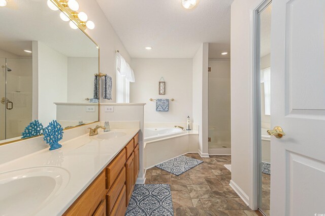 2479 Glen Dr, Little River, SC 29566 - bathroom with a shower stall, a bath, double vanity, stone finish floors, and baseboards