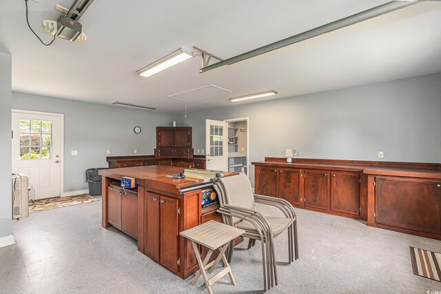 2479 Glen Dr, Little River, SC 29566 - kitchen with dark countertops, baseboards, and a kitchen island