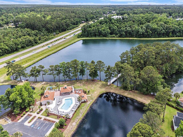 2479 Glen Dr, Little River, SC 29566 - aerial view of property's location featuring a heavily wooded area, a nearby body of water, and a pool