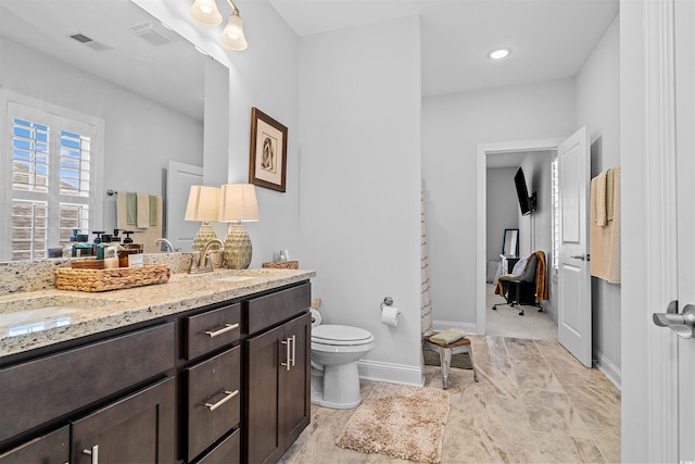 1106 Tarpon Pond Rd, North Myrtle Beach, SC 29582 - full bathroom with toilet, double vanity, and baseboards