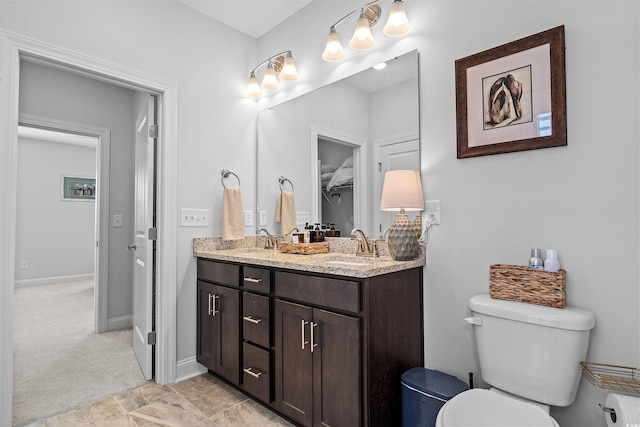 1106 Tarpon Pond Rd, North Myrtle Beach, SC 29582 - bathroom with toilet, double vanity, and baseboards