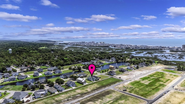 1106 Tarpon Pond Rd, North Myrtle Beach, SC 29582 - aerial perspective of suburban area with a large body of water