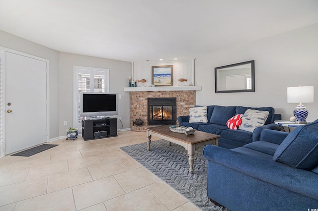 1801 N Ocean Blvd Unit Q-2, North Myrtle Beach, SC 29582 - living room featuring light tile patterned floors, a brick fireplace, and baseboards