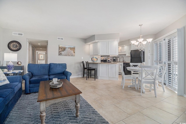 1801 N Ocean Blvd Unit Q-2, North Myrtle Beach, SC 29582 - living room with a chandelier and baseboards