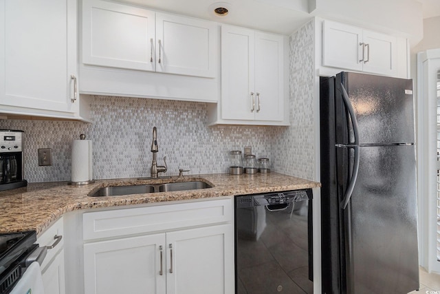 1801 N Ocean Blvd Unit Q-2, North Myrtle Beach, SC 29582 - kitchen with black appliances, a sink, and white cabinetry