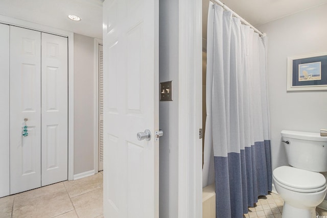 1801 N Ocean Blvd Unit Q-2, North Myrtle Beach, SC 29582 - bathroom featuring a closet, tile patterned flooring, toilet, a shower with shower curtain, and baseboards