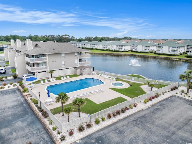 1801 N Ocean Blvd Unit Q-2, North Myrtle Beach, SC 29582 - community pool with a fenced backyard, a residential view, a water view, and a patio