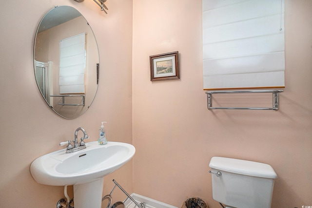 212 Millwood Dr, Surfside Beach, SC 29575 - bathroom with toilet, baseboards, and a sink