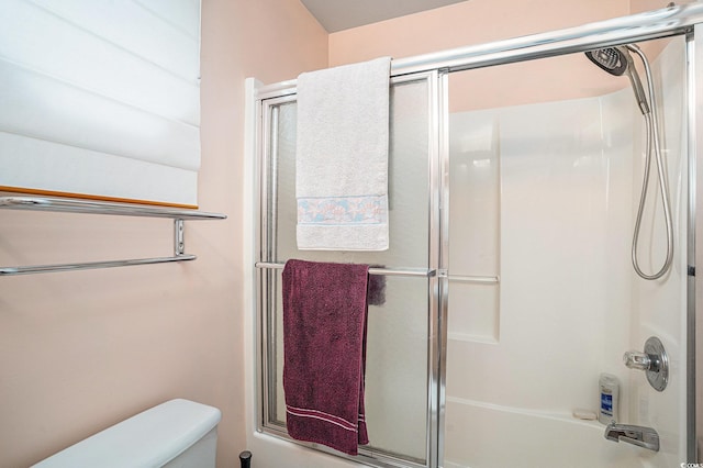 212 Millwood Dr, Surfside Beach, SC 29575 - bathroom featuring combined bath / shower with glass door and toilet