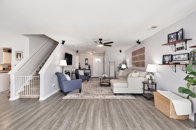 1209 Eagle Creek Dr, Myrtle Beach, SC 29588 - living room featuring light wood-type flooring, a ceiling fan, baseboards, and stairs
