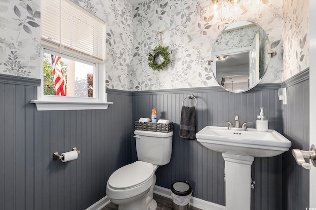 1209 Eagle Creek Dr, Myrtle Beach, SC 29588 - bathroom with wallpapered walls, a wainscoted wall, toilet, and a sink