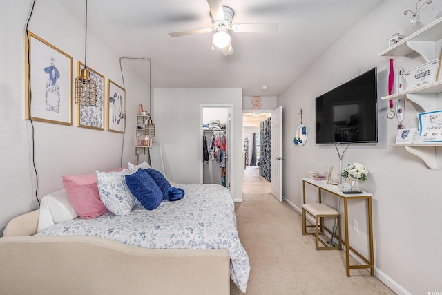 1209 Eagle Creek Dr, Myrtle Beach, SC 29588 - bedroom featuring a walk in closet, light carpet, baseboards, and ceiling fan