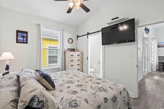 6001-1737 S Kings Hwy, Myrtle Beach, SC 29575 - bedroom with a barn door, lofted ceiling, wood finished floors, ceiling fan, and ensuite bathroom