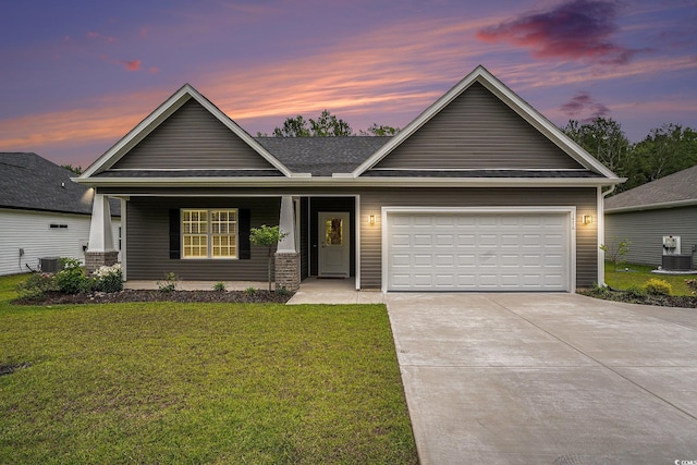 1476 Burriss Rd, Conway, SC 29526 - view of front of property featuring a lawn, driveway, cooling unit, an attached garage, and covered porch