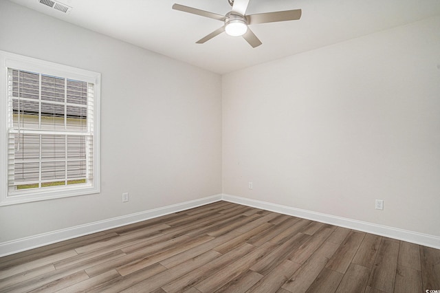 1476 Burriss Rd, Conway, SC 29526 - spare room with wood finished floors, a ceiling fan, and baseboards