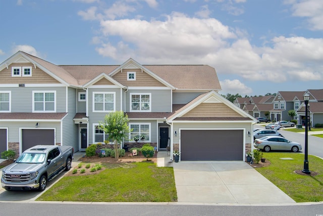 115 Machrie Loop Unit D, Myrtle Beach, SC 29588 - view of front facade featuring driveway, stone siding, a front lawn, and an attached garage
