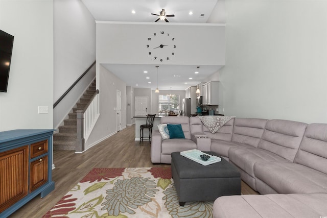 115 Machrie Loop Unit D, Myrtle Beach, SC 29588 - living room featuring stairs, light wood-type flooring, a high ceiling, recessed lighting, and baseboards