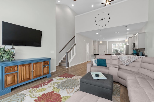 115 Machrie Loop Unit D, Myrtle Beach, SC 29588 - living area featuring high vaulted ceiling, ceiling fan, stairway, light wood-style flooring, and recessed lighting