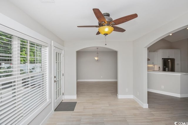 231 Marbella Dr, Murrells Inlet, SC 29576 - unfurnished room featuring arched walkways, ceiling fan, and baseboards