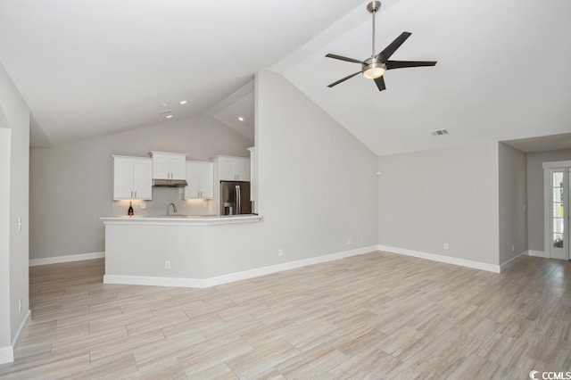 231 Marbella Dr, Murrells Inlet, SC 29576 - unfurnished living room with lofted ceiling, ceiling fan, light wood-style floors, and baseboards