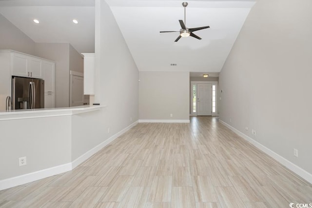231 Marbella Dr, Murrells Inlet, SC 29576 - unfurnished living room with lofted ceiling, ceiling fan, baseboards, light wood-type flooring, and recessed lighting