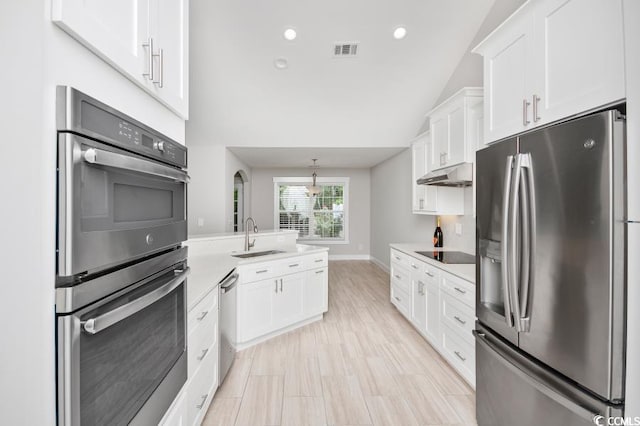 231 Marbella Dr, Murrells Inlet, SC 29576 - kitchen featuring stainless steel appliances, a sink, under cabinet range hood, light countertops, and white cabinets