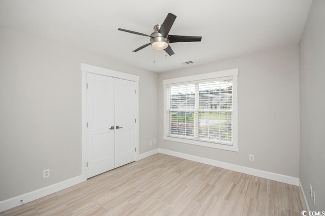 231 Marbella Dr, Murrells Inlet, SC 29576 - unfurnished bedroom with baseboards, light wood-type flooring, and a closet