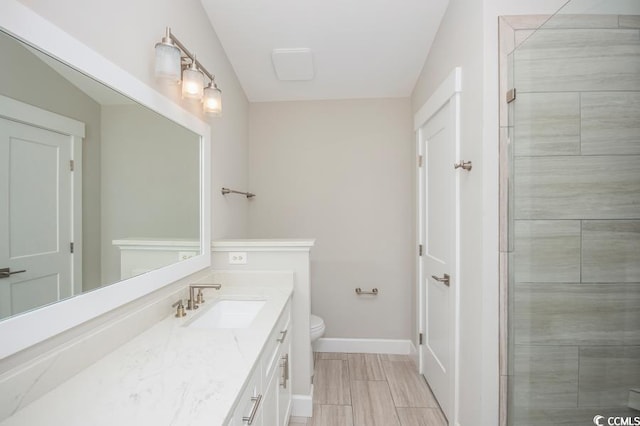 231 Marbella Dr, Murrells Inlet, SC 29576 - bathroom featuring vanity, toilet, tiled shower, and baseboards