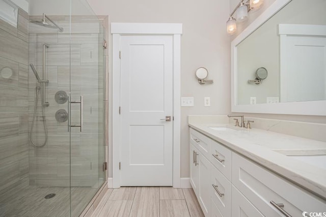 231 Marbella Dr, Murrells Inlet, SC 29576 - bathroom featuring double vanity, a shower stall, and baseboards
