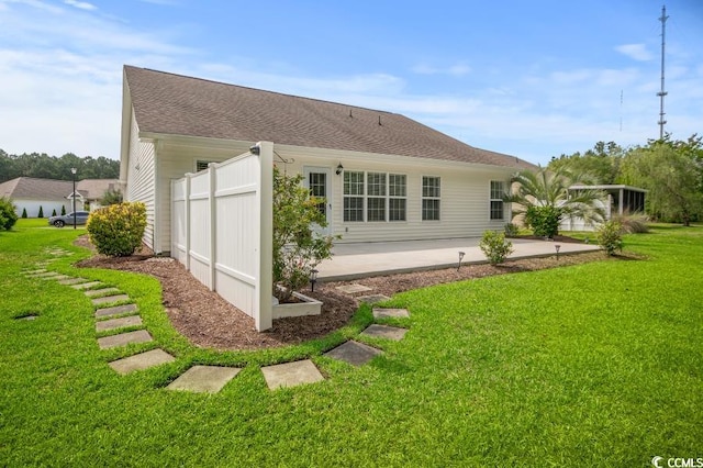 231 Marbella Dr, Murrells Inlet, SC 29576 - back of house with a patio, a lawn, and a shingled roof