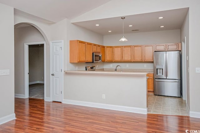 908 Wrigley Dr Unit 17-317-3G, Myrtle Beach, SC 29588 - kitchen with appliances with stainless steel finishes, light countertops, light wood-style flooring, a peninsula, and recessed lighting