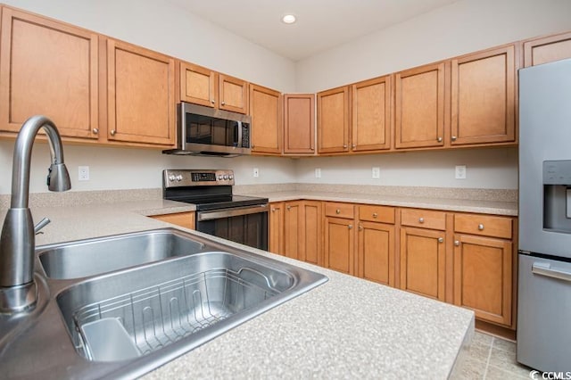 908 Wrigley Dr Unit 17-317-3G, Myrtle Beach, SC 29588 - kitchen with appliances with stainless steel finishes, light countertops, brown cabinets, and recessed lighting