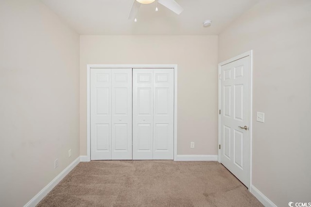 908 Wrigley Dr Unit 17-317-3G, Myrtle Beach, SC 29588 - unfurnished bedroom with carpet flooring, a closet, and a ceiling fan