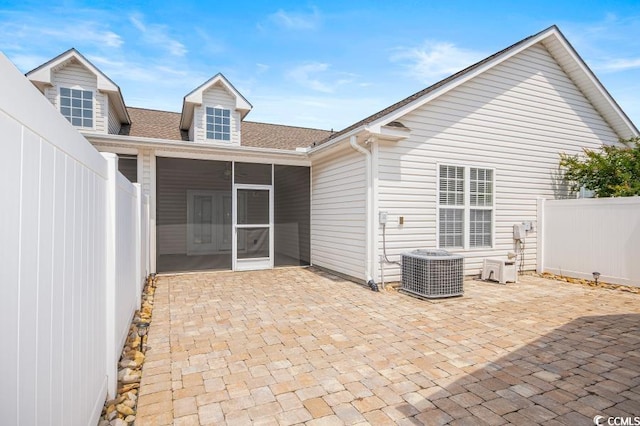 908 Wrigley Dr Unit 17-317-3G, Myrtle Beach, SC 29588 - back of house featuring a sunroom, a patio area, a fenced backyard, and a shingled roof
