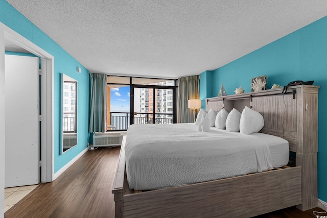 1501 Ocean Blvd S Unit 1249, Myrtle Beach, SC 29577 - bedroom with a textured ceiling, access to exterior, and wood finished floors