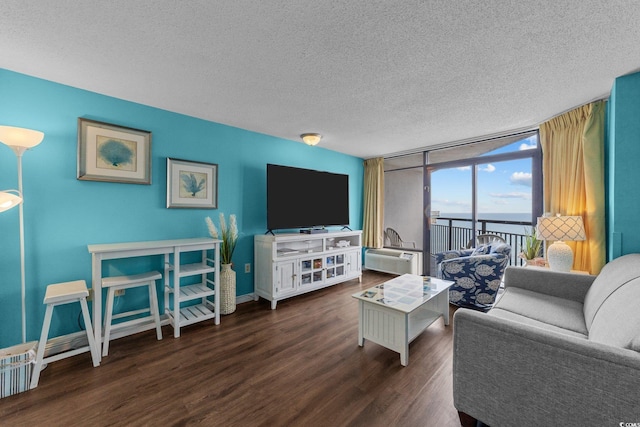 1501 Ocean Blvd S Unit 1249, Myrtle Beach, SC 29577 - living room with a textured ceiling, wood finished floors, floor to ceiling windows, baseboards, and an AC wall unit