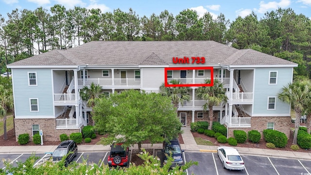 6253 Catalina Dr Unit 733, North Myrtle Beach, SC 29582 - view of property featuring uncovered parking and stairs