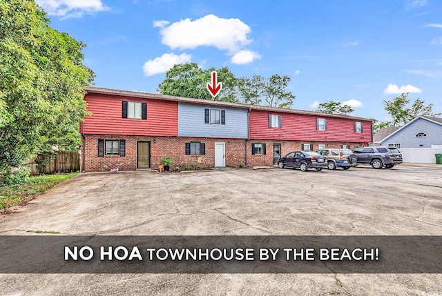 633 Sparrow Dr Unit B, Surfside Beach, SC 29575 - view of front of home with brick siding and uncovered parking