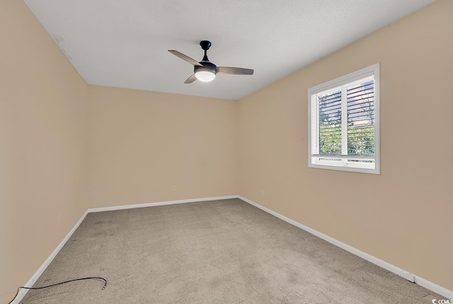633 Sparrow Dr Unit B, Surfside Beach, SC 29575 - spare room featuring baseboards, carpet flooring, and a ceiling fan