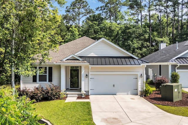 340 Scottsdale Ct, Murrells Inlet, SC 29576 - ranch-style house with a standing seam roof, concrete driveway, a garage, a shingled roof, and metal roof