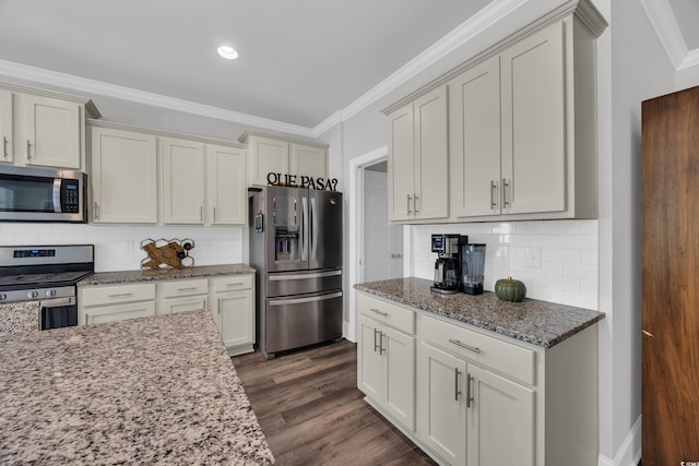 340 Scottsdale Ct, Murrells Inlet, SC 29576 - kitchen featuring appliances with stainless steel finishes, crown molding, light stone countertops, tasteful backsplash, and dark wood-type flooring
