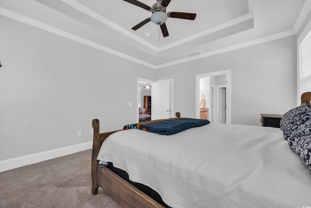 340 Scottsdale Ct, Murrells Inlet, SC 29576 - carpeted bedroom featuring a tray ceiling, ornamental molding, a ceiling fan, baseboards, and ensuite bath