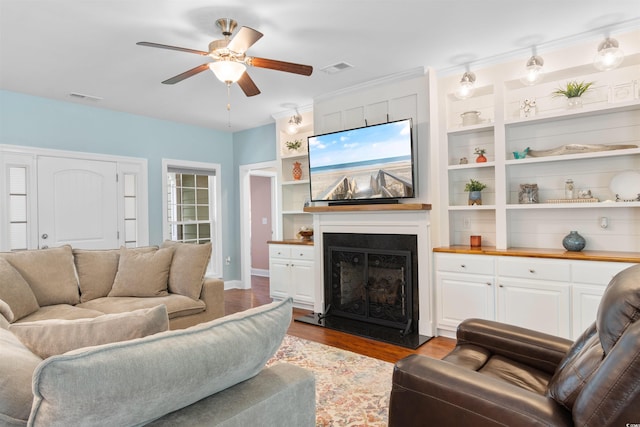 116 Chapel Ridge Cir, Myrtle Beach, SC 29588 - living room with a ceiling fan, wood finished floors, a fireplace with flush hearth, and built in features