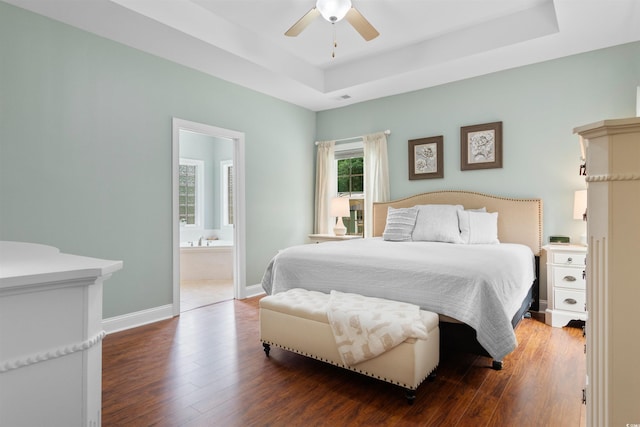 116 Chapel Ridge Cir, Myrtle Beach, SC 29588 - bedroom featuring a raised ceiling, wood finished floors, baseboards, a ceiling fan, and ensuite bath