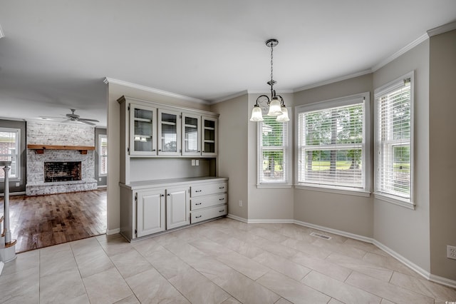 3334 Cedar Creek Run, Little River, SC 29566 - unfurnished dining area featuring plenty of natural light, baseboards, a ceiling fan, and ornamental molding