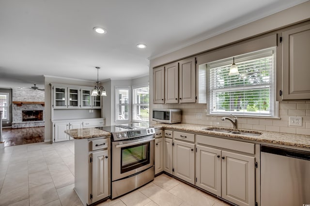 3334 Cedar Creek Run, Little River, SC 29566 - kitchen with appliances with stainless steel finishes, a sink, healthy amount of natural light, ornamental molding, and recessed lighting